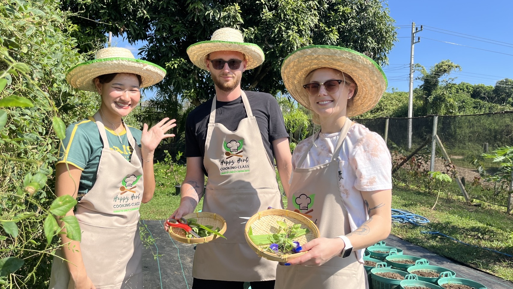 Happy Herb cooking class students with their chef in Chiang Mai