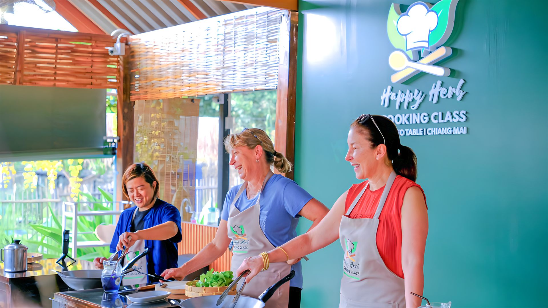 Happy Herb guests cooking together in Chiang Mai