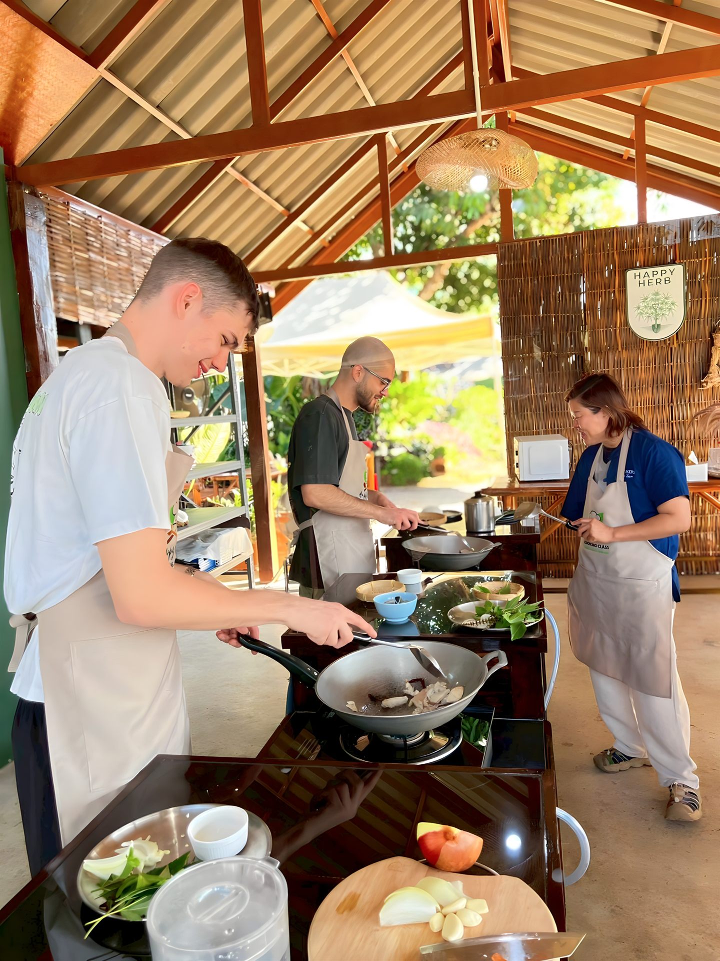 Guests cooking fresh Thai food at Happy Herb