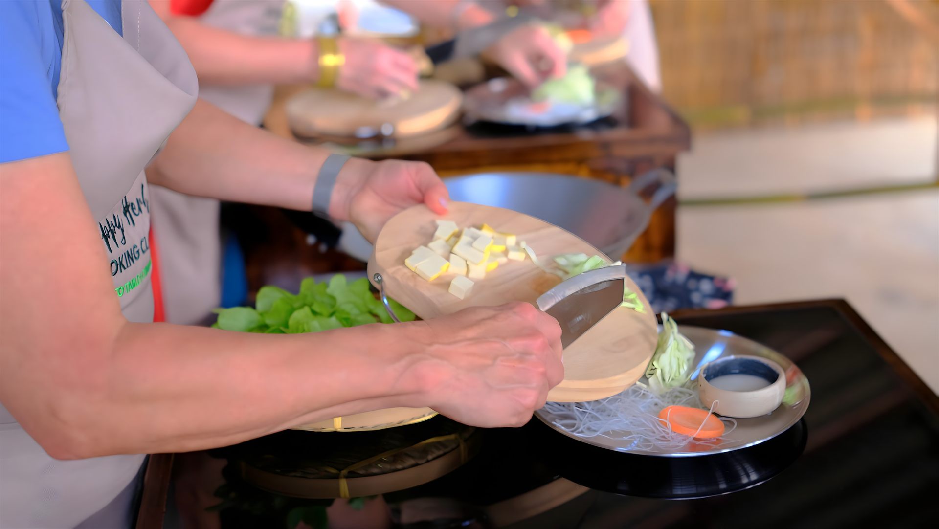 Cooking with fresh coconut milk in the Happy Herb Thai cooking class