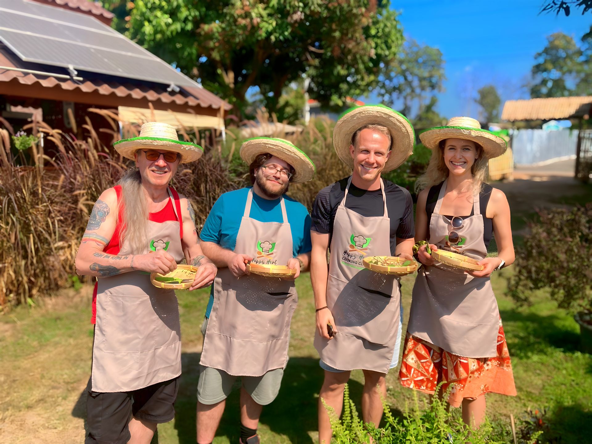 Happy Herb Thai cooking class group photo on the farm in Chiang Mai